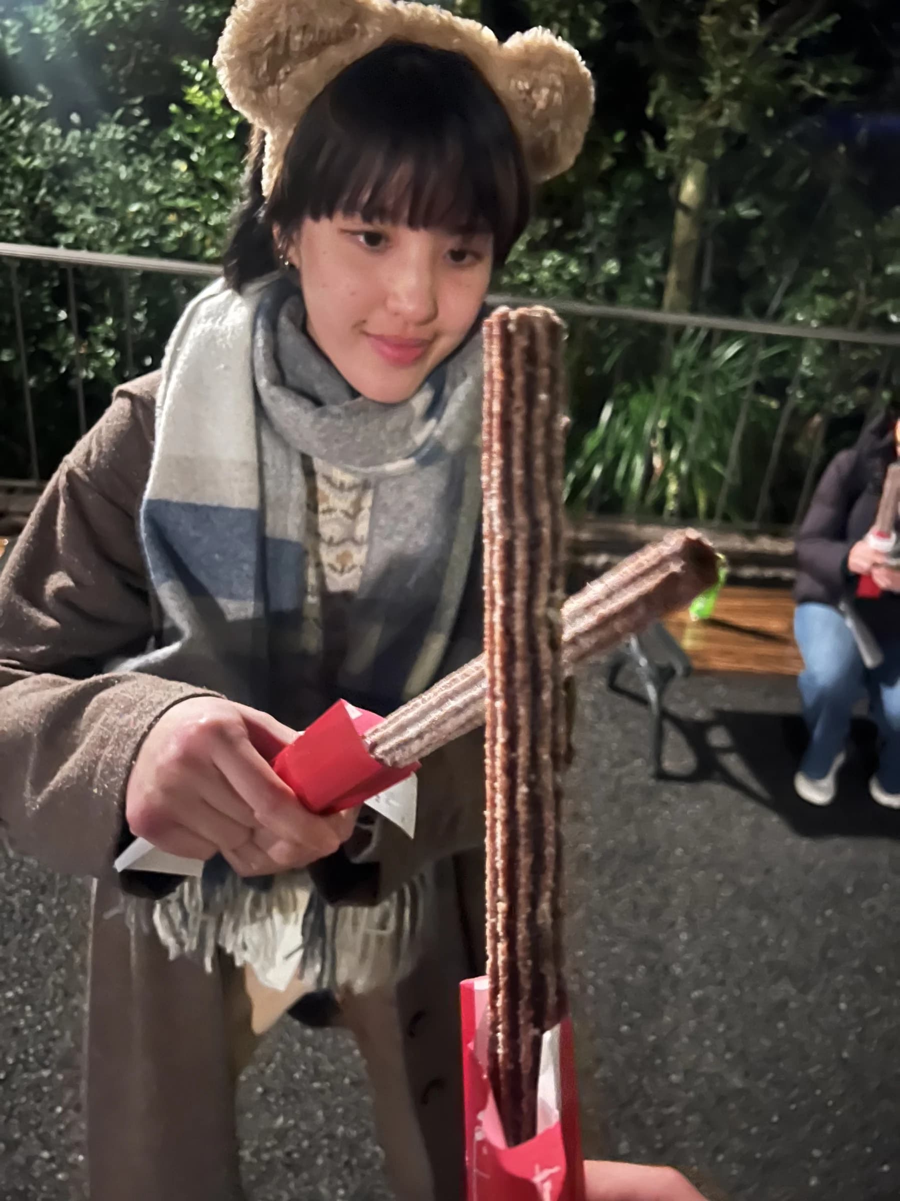 Becky in bear ears with churros at Tokyo DisneySea on her birthday